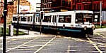 Metrolink Tram crossing Withy Grove in Manchester City Centre